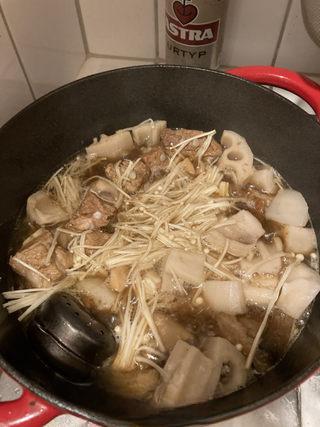 Braised Spare Ribs with Lotus Root and Mushrooms step 12: Add the lotus root and enoki mushrooms. Cover and continue braising for 15 minut