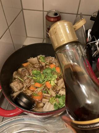 Braised Spare Ribs with Lotus Root and Mushrooms step 14: Sprinkle with celery leaves and drizzle with a few drops of sesame oil.