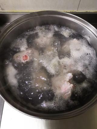 Braised Pork Trotters step 2: Once boiling, skim off any foam and impurities. Continue boiling for 2 minutes,
