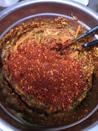 Fruit Kimchi with Napa Cabbage step 14: Add Sichuan pepper flakes if desired for extra heat and numbing flavor.