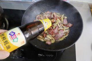 Stir-Fried Mushrooms with Cured Pork step 6: Add a little water, a pinch of sugar, and oyster sauce. Stir well and cook brief
