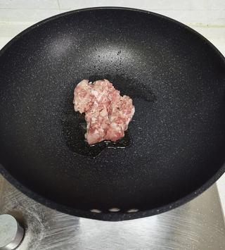 Mashed Potato Volcano with Braised Pork Sauce step 7: Heat oil in a skillet over medium heat. Add the minced pork and stir-fry until s