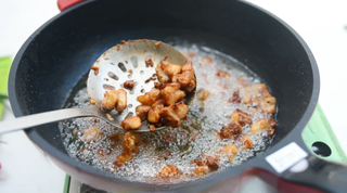 Spicy Fried Chicken with Peanuts step 7: Increase the oil temperature to about 390°F (200°C) and fry the chicken a second