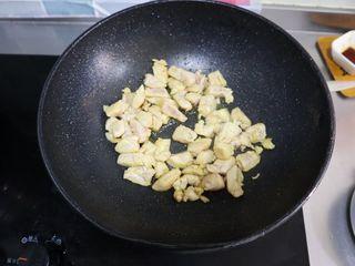 Kung Pao Chicken step 7: Heat oil in a wok and stir-fry the chicken until fully cooked. Remove and set as