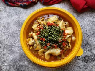 Spicy and Numbing Fish Hotpot step 20: Top with green Sichuan peppercorns and bird's eye chilies.