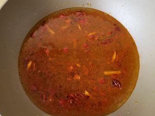 Spicy and Numbing Fish Hotpot step 8: Pour in boiling water and bring the broth to a vigorous boil.