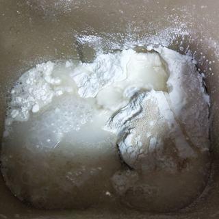 Milk Custard Steamed Buns step 2: Add the water and knead into a smooth dough.