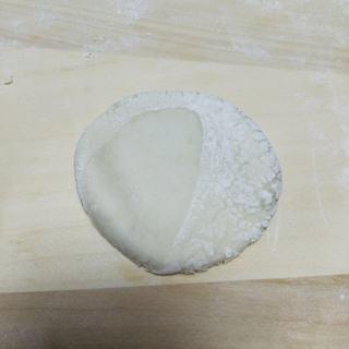 Milk Custard Steamed Buns step 22: Flatten one dough portion.
