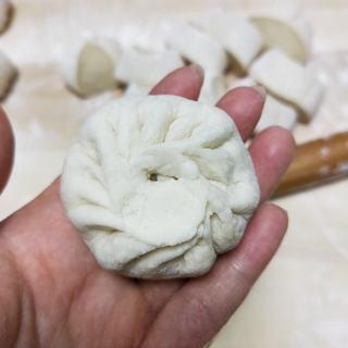 Milk Custard Steamed Buns step 24: Place a custard filling ball in the center.