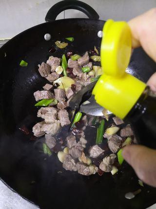 Braised Beef Brisket step 10: Add the dark soy sauce.