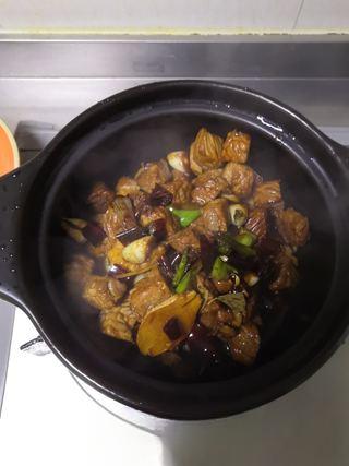 Braised Beef Brisket step 13: Transfer everything to a clay pot or Dutch oven.