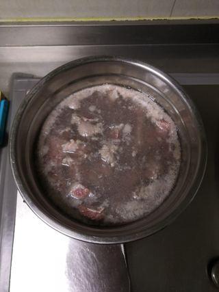 Braised Beef Brisket step 3: Skim off any foam and impurities that rise to the surface.