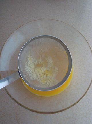 Steamed Milk Custard with Mango and Honey Almonds step 4: Strain the egg mixture through a fine sieve.
