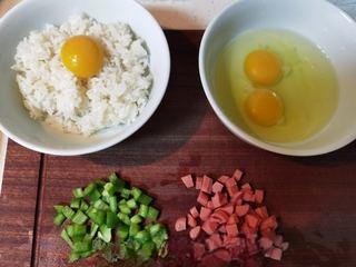 Golden Egg Fried Rice Recipe step 2: Dice the sausage and green pepper. Separate one egg yolk and mix it with the ric