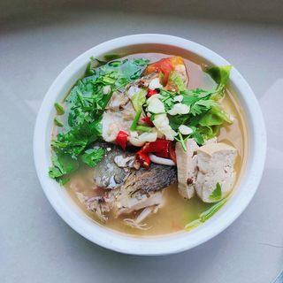 Catfish and Tofu Vegetable Soup step 14: Transfer the soup to a serving bowl and top with cilantro, minced ginger, and dr