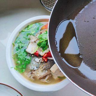 Catfish and Tofu Vegetable Soup step 15: Heat a small amount of oil until hot and pour it over the garnish to release its