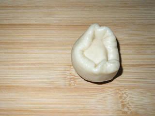 Red Bean and Jujube Paste Pastries step 12: Wrap each pastry dough portion inside a water-oil dough portion.