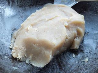 Red Bean and Jujube Paste Pastries step 4: Transfer the red bean paste to a pan. Add sugar and cook over low heat, adding p