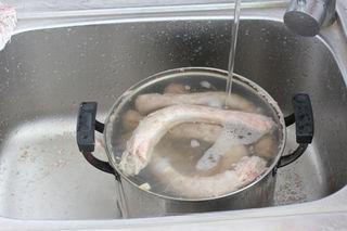 Spicy Braised Duck Necks step 12: Remove and rinse away any foam or impurities.
