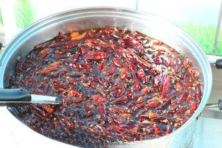 Spicy Braised Duck Necks step 6: Transfer the fried chilies, peppercorns, and oil into a large stockpot.