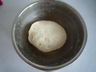 Steamed Milk Bread Rolls step 2: Mix the flour with yeast and sugar. Gradually add milk and knead into a smooth d