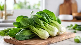Fresh bok choy on a wooden cutting board