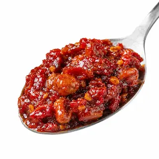 Close-up of doubanjiang chili bean paste on a spoon