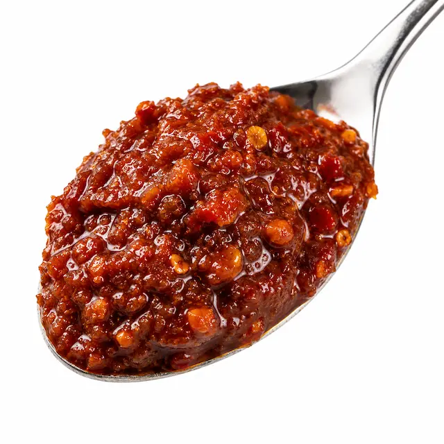 Close-up of spicy miso chili paste substitute on a spoon